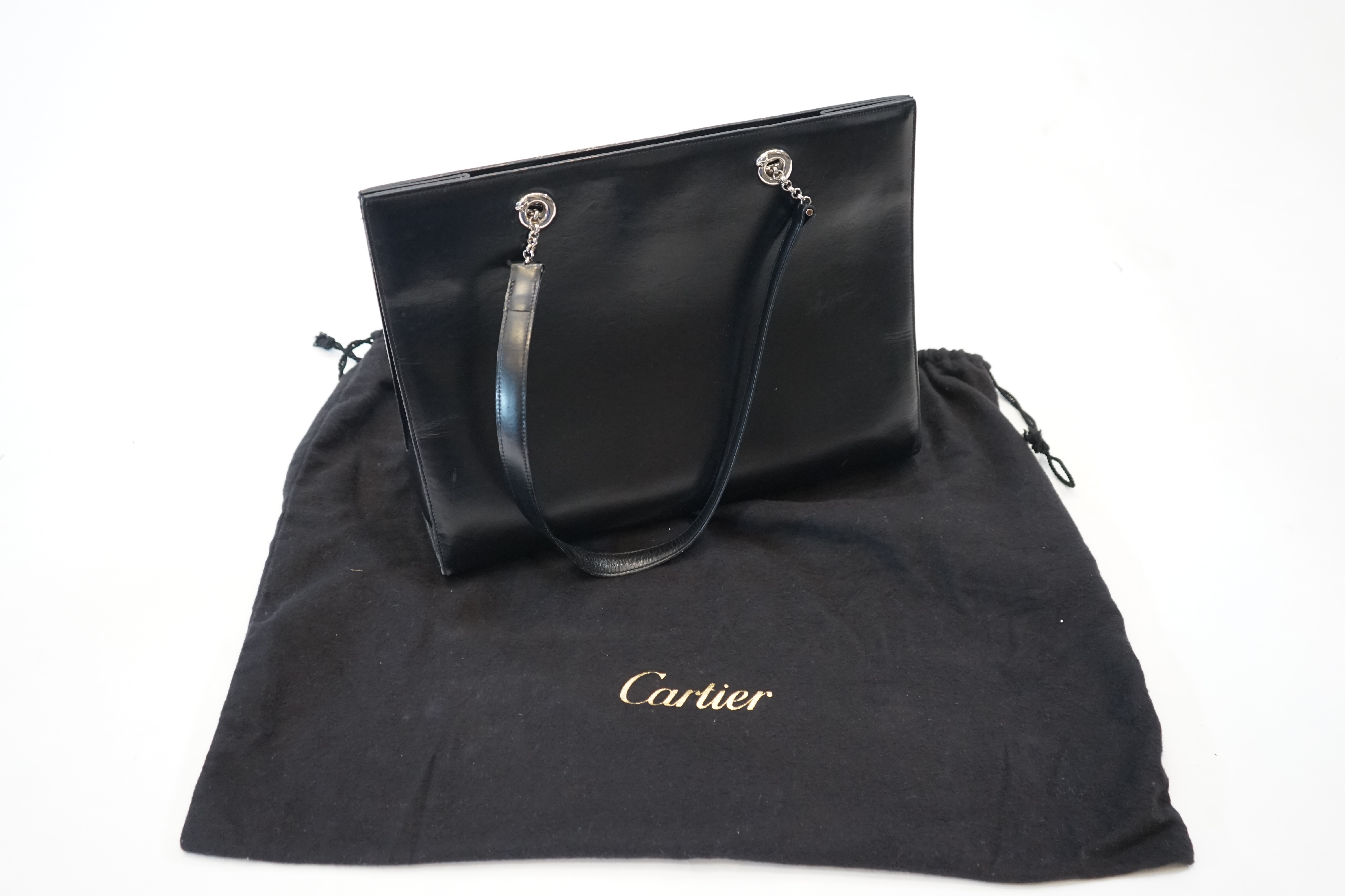 A Cartier Panthère shopping bag in black leather, width 37cm, depth 13cm, height 28cm